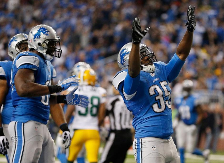 Joique Bell, de los Lions de Detroit, celebra su touchdown frente a los Packers de Green Bay, en el Ford Field en Detroit, Michigan. (Foto: Gregory Shamus/AFP)