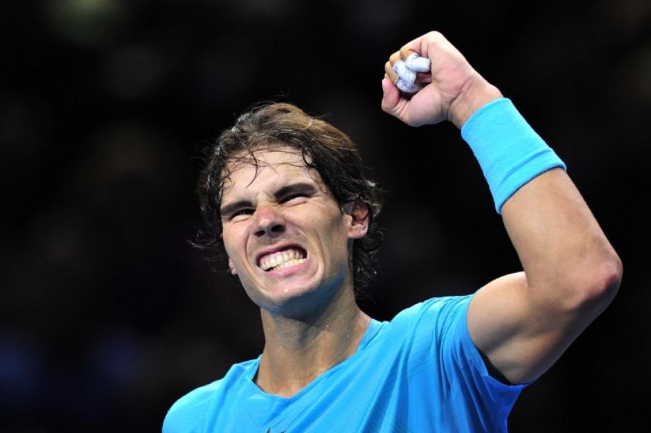 Rafael Nadal festeja con el pu&ntilde;o arriba tras vencer a Ferrer en el torneo de Maestros de Londres. (Glin Kirk/AFP)