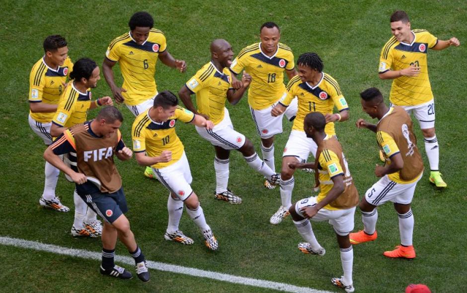 A ritmo de cumbia y vallenato celebraron los colombianos ante Costa de Marfil. Los cafeteros comandan el grupo C, del Mundial Brasil 2014. (Foto: AFP)