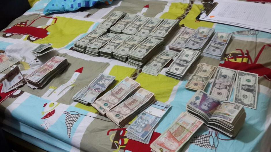 Localizan m&aacute;s de 60 mil d&oacute;lares en la vivienda de una mujer taiwanesa. (Foto: PNC)