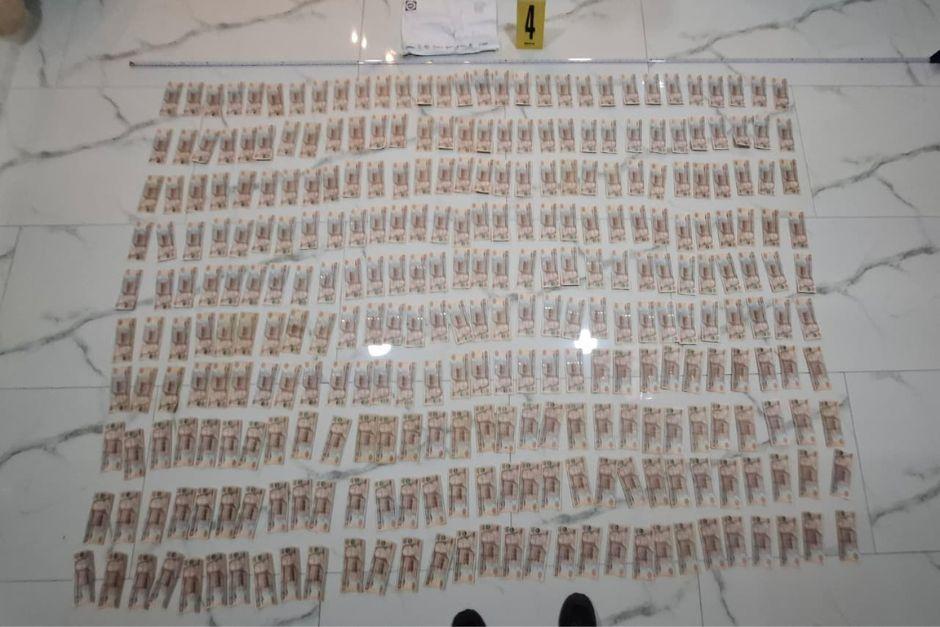 Durante el allanamiento fue incautado un total de Q30 mil en efectivo. (Foto: MP)