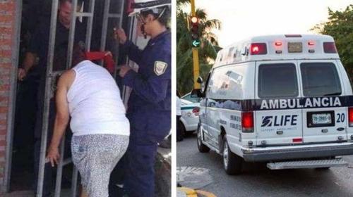 Mujer queda atrapada en una reja por espiar a su vecina